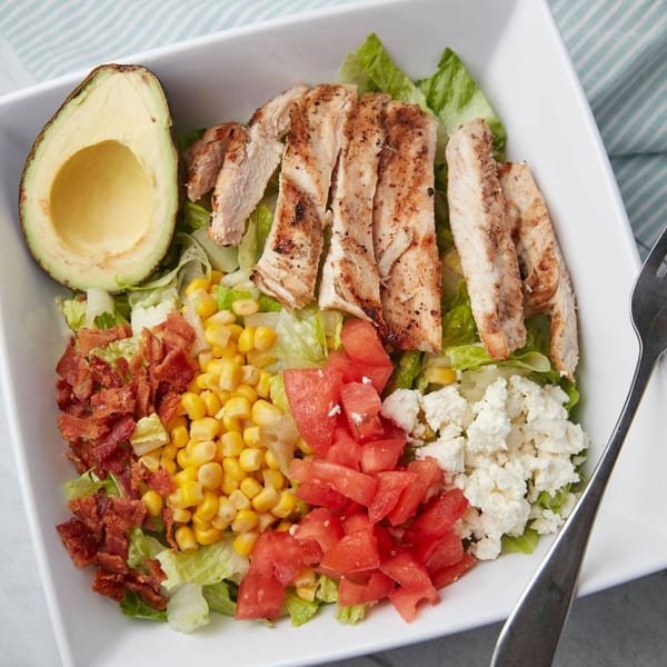 John's Place Cobb salad with grilled chicken, avocado, bacon, corn, tomatoes, and feta cheese.